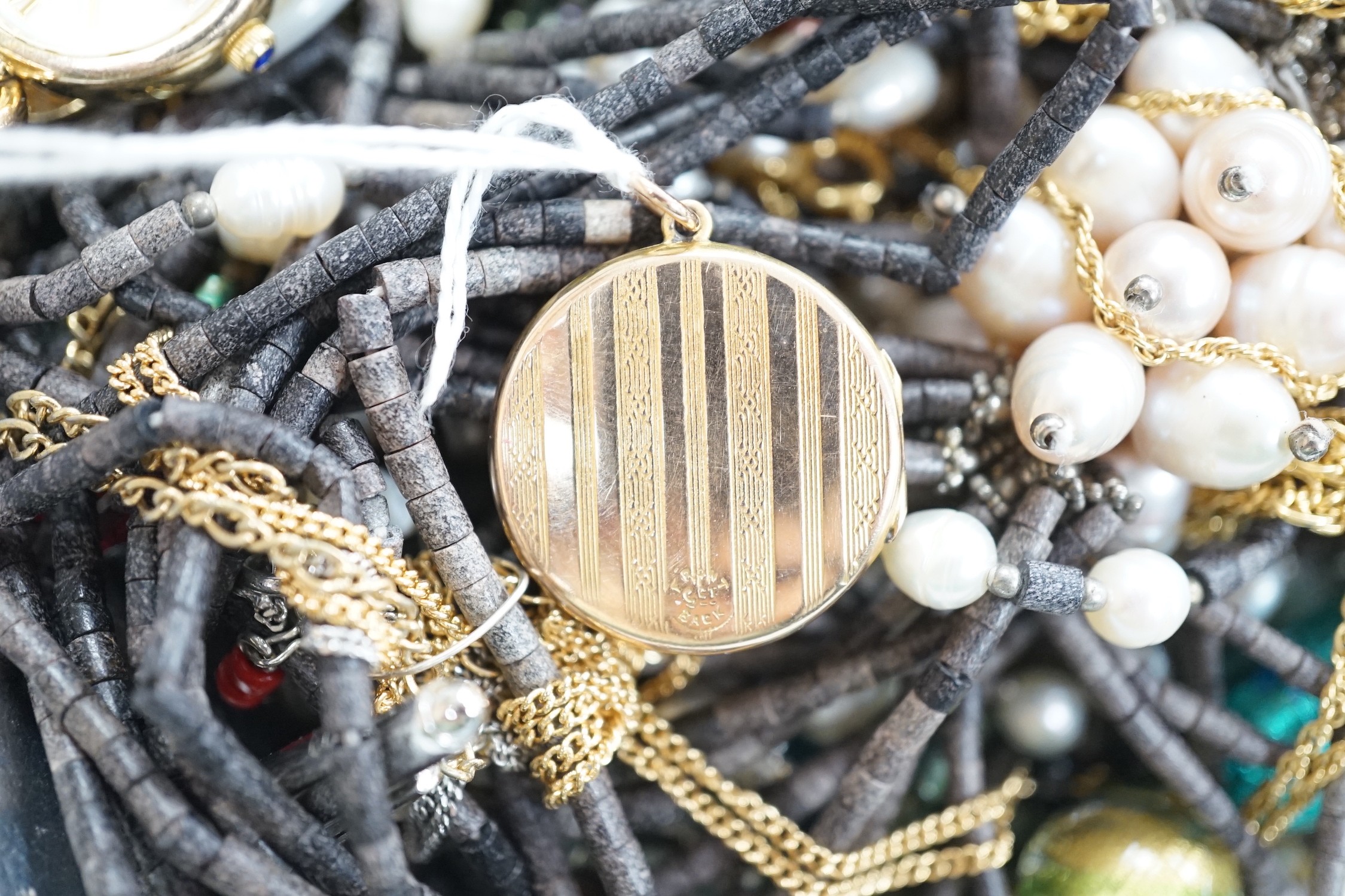 Assorted costume jewellery, including 9ct back and front locket, compass pendant, necklaces etc.